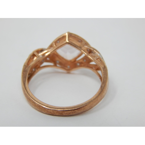 263 - 9ct Rose Gold Ring Set with a Central Pink Topaz within a Diamond Border: Ring Size M: Gross weight ... 