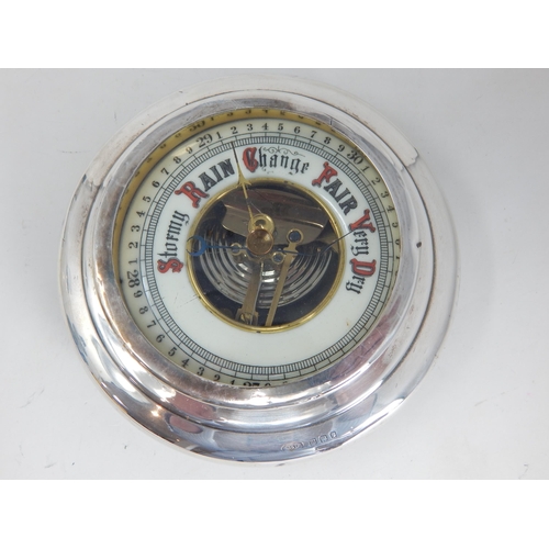 285 - Silver Cased Barometer: Hallmarked London 1927. Measuring 13.8cm diameter