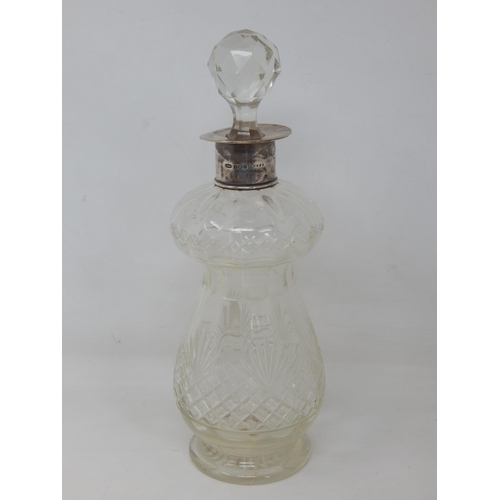 286 - Silver Mounted Cut Glass Decanter & Stopper: Hallmarked Birmingham 1913 by John Grinsell. Height 28c... 