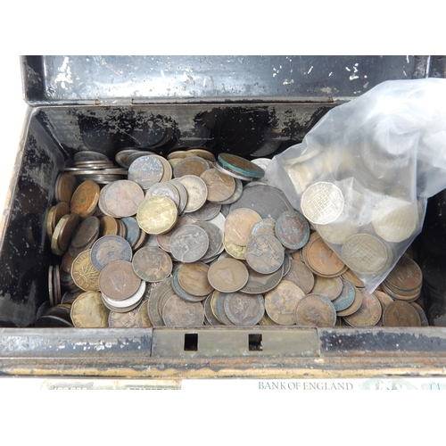 178 - Vintage cash tin containing a quantity of mixed world coinage and a couple of banknotes