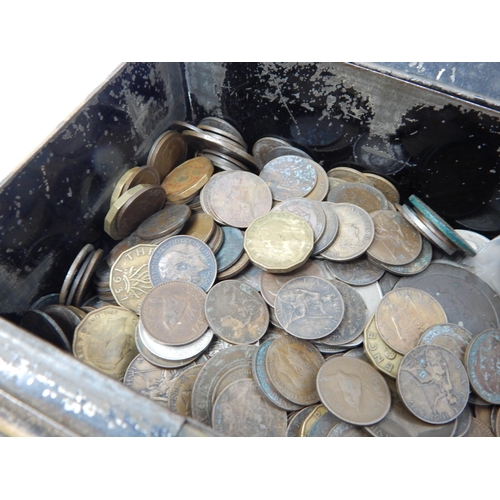 178 - Vintage cash tin containing a quantity of mixed world coinage and a couple of banknotes