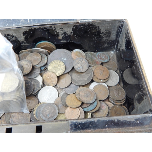 178 - Vintage cash tin containing a quantity of mixed world coinage and a couple of banknotes