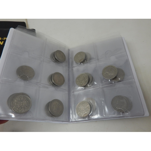 128 - A large collection of coins housed in 4 collectors albums