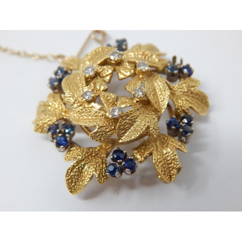 294 - 18ct Gold Diamond & Sapphire Set Flower Brooch: Gross weight 12g. (One Stone Vacant)