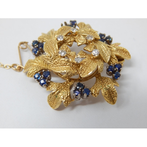 294 - 18ct Gold Diamond & Sapphire Set Flower Brooch: Gross weight 12g. (One Stone Vacant)