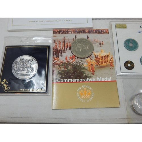 181 - Walt Disney Commemorative Medal 1996, UK Brilliant Uncirculated £2 coin 1997; set of Chinese currenc... 