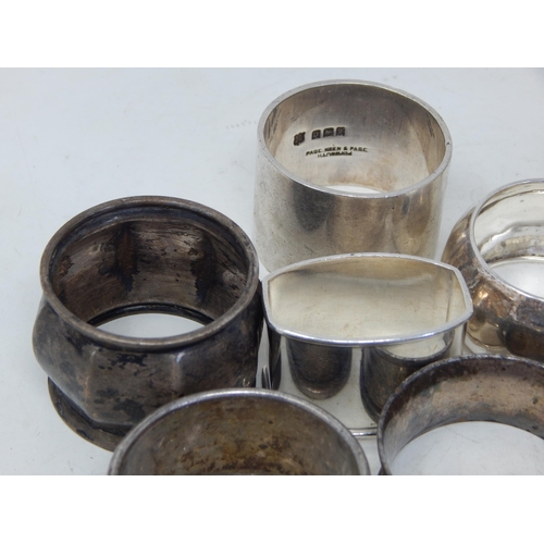 343 - 11 x Hallmarked Silver Napkin Rings: Various Dates & Makers: Weight 286g