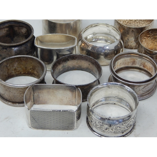 343 - 11 x Hallmarked Silver Napkin Rings: Various Dates & Makers: Weight 286g