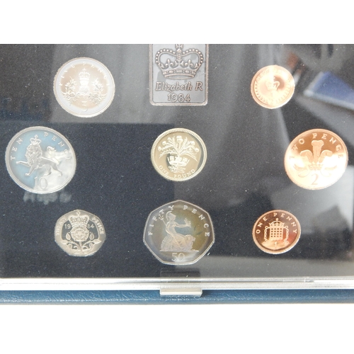 49 - UK Proof sets 1983(2), 1984, 1985, 1993 including £5 coin all housed in Royal Mint cases of issue wi... 