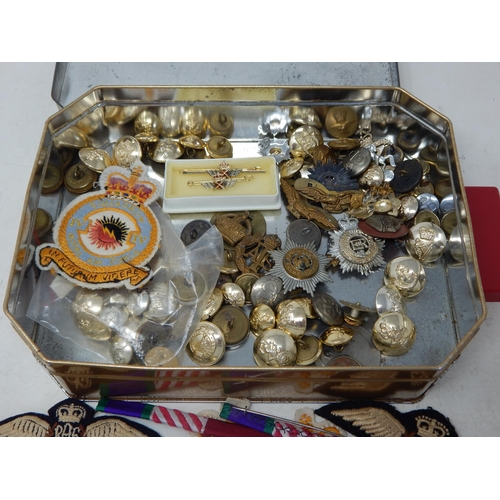 103 - A tin containing a large collection of RAF Cloth badges Military Buttons, etc (lot)