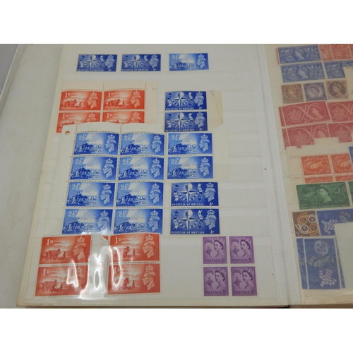 100 - A red stock book containing a massive collection of Mint GB Stamps from King Edward VII to QEII incl... 