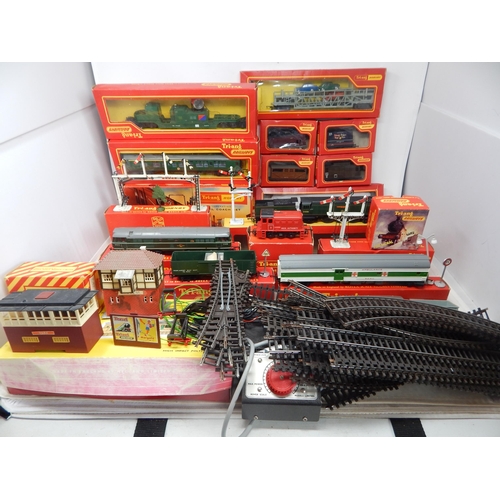 A Large Quantity of Tri-ang Hornby Railway Items to Include: Battle of Britain Loco "Winston Churchill" with R-38 Tender (Boxed), AIA-AIA Diesel Electric Loco (Boxed), Track Cleaning Car (Boxed), Dock Authority Loco, + Boxed Searchlight Wagon, 1st Coach with Seats, Baggage Car, Snow Plough, Transporter with Cars, Buffet Car, Mineral Wagon, Continent Guards Van, Open Goods Truck, Ambulance Carriage, Other Goods Trucks, Station Kit, Fog Signal, Footbridge, Signals, Buildings, Power Units & Track. (lot)