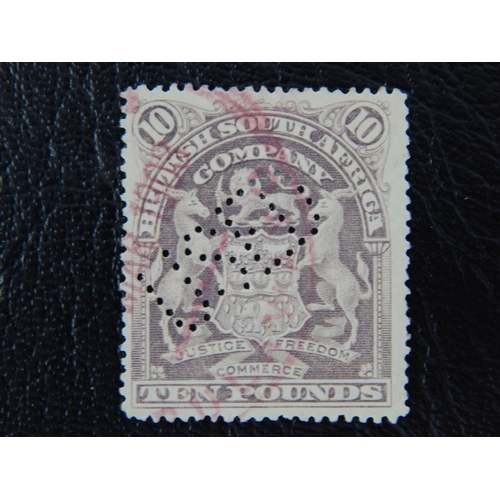 RHODESIA 19-1908 £10 Lilac SG 93 perfin “used” diagonally and physically used.