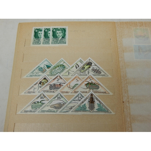 311 - A large collection of Mint Stamps housed in vintage album including Bolivia, Uruguay, Argentina, Cam... 