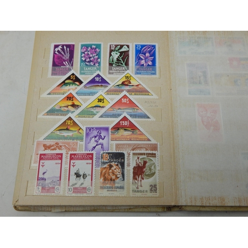 311 - A large collection of Mint Stamps housed in vintage album including Bolivia, Uruguay, Argentina, Cam... 