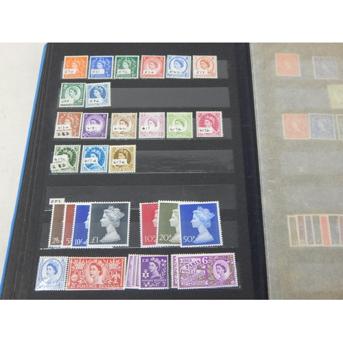 312 - A partially filled stock book containing a useful selection of KGV, KGVI and QEII Mint stamps, some ... 