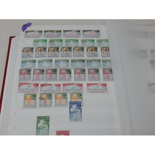 317 - Red stockbook containing a partially filled collection of Zanzibar