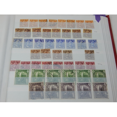 317 - Red stockbook containing a partially filled collection of Zanzibar