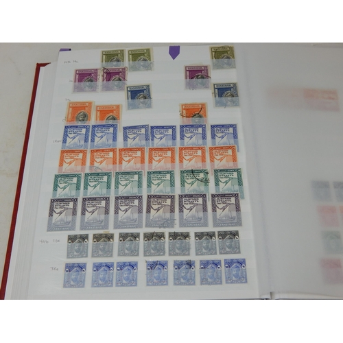 317 - Red stockbook containing a partially filled collection of Zanzibar