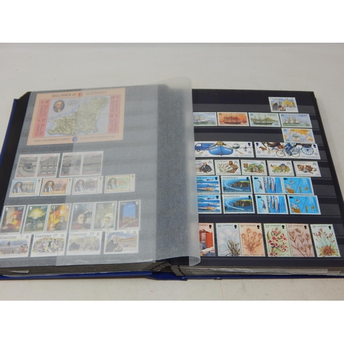 793 - A large album full of Channel Island stamps. Mainly mint.