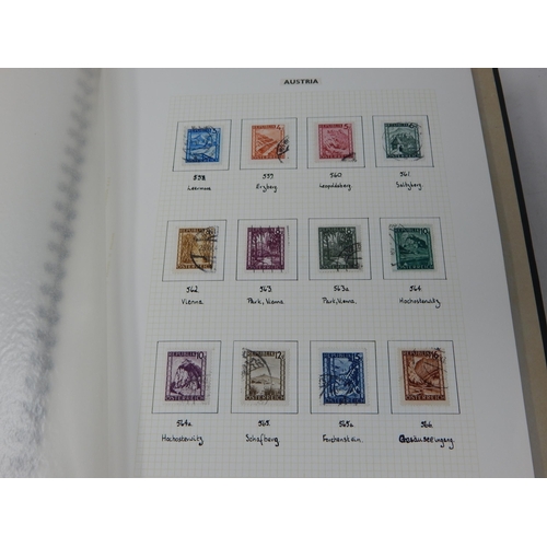 791 - World stamp album in box. Partially full.