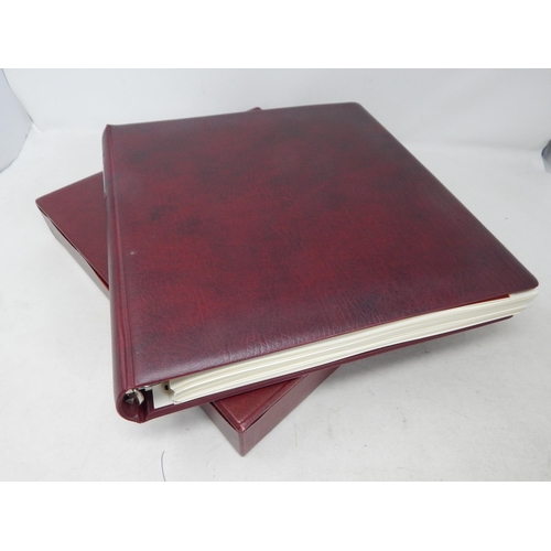 768 - A fabulous large red stamp album with inserts.