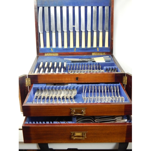 Edwardian Extensive Part Canteen of Cutlery for 12 Place Settings Contained within a Two Drawer & Hinged Topped Mahogany Wellington Canteen by James Dixon & Sons. The Knives with Ivorine Handles.