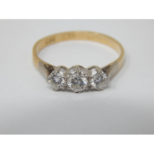 18ct Yellow Gold & Platinum Diamond Trilogy Ring. The Central Diamond Estimated @ 0.30ct Flanked Either Side with a Diamond Estimated @ 0.17cts: Total Diamond Weight 0.64cts: Size O/P: Gross weight 2.8g