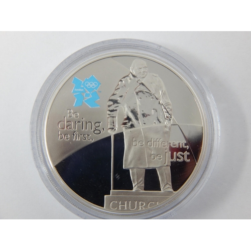 104 - Winston Churchill Silver Proof Commemorative £5 Coin together with a Churchill London Games 2012 £5 ... 