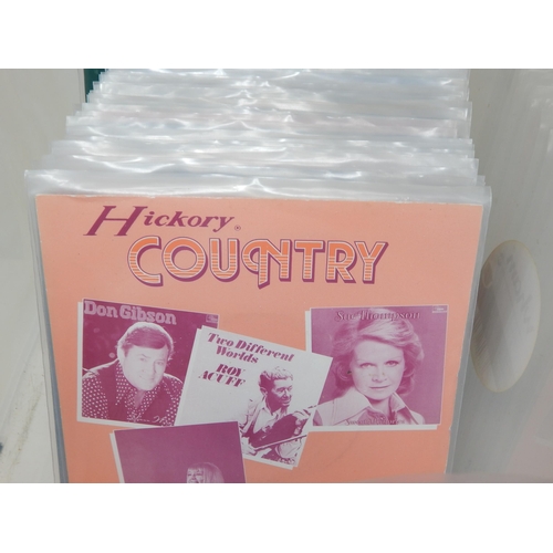 582 - A collection of 100 single 45rpm records all records are housed in plastic protective sleeves from t... 