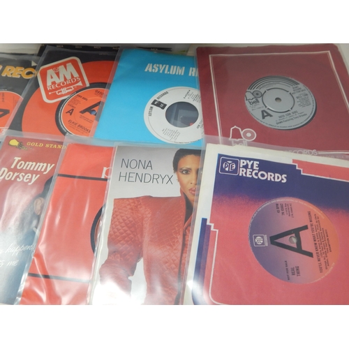 583 - A collection of 100 single 45rpm records all housed in plastic protective sleeves from the estate of... 