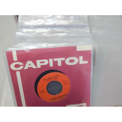 584 - A collection of 100 single 45rpm records all housed in protective plastic sleeves from the estate of... 