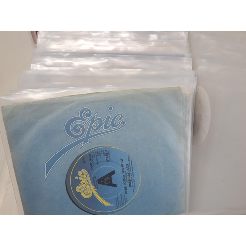 584 - A collection of 100 single 45rpm records all housed in protective plastic sleeves from the estate of... 