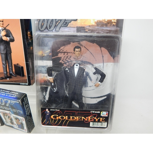 597 - 007 James Bond Figures & Model Kit together with Two Packs of 007 Playing Cards.