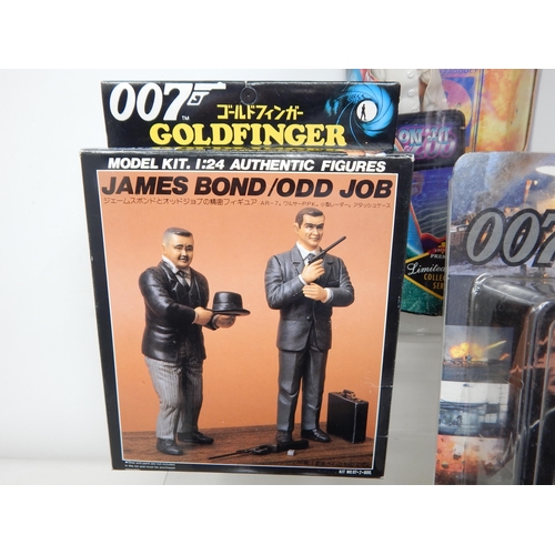 597 - 007 James Bond Figures & Model Kit together with Two Packs of 007 Playing Cards.