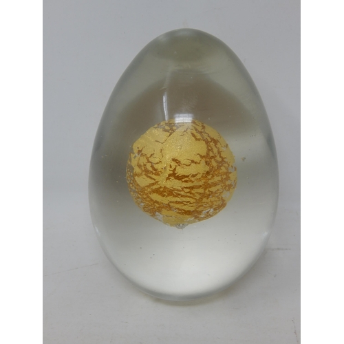 544 - Signed Egg Shaped Glass paperweight with Inner Gold Sphere on Glass Stand: Height 10cm