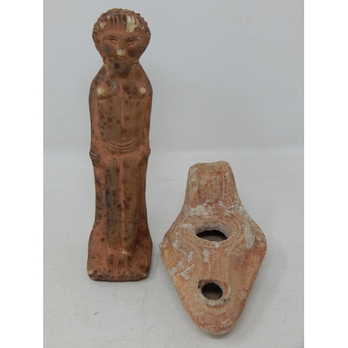 555 - Egyptian Terracotta Tomb Figure 14cm high together with an Egyptian Terracotta Oil Lamp.