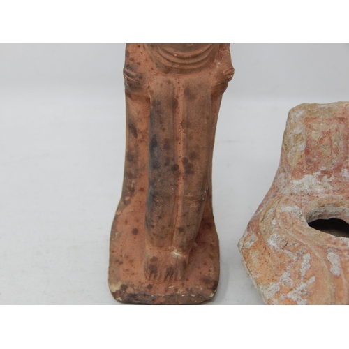 555 - Egyptian Terracotta Tomb Figure 14cm high together with an Egyptian Terracotta Oil Lamp.