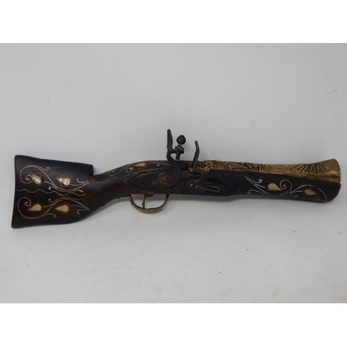 435 - Eastern Gun with Wooden Stock Inlaid with Mother of Pearl: 40cm long