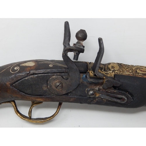 435 - Eastern Gun with Wooden Stock Inlaid with Mother of Pearl: 40cm long