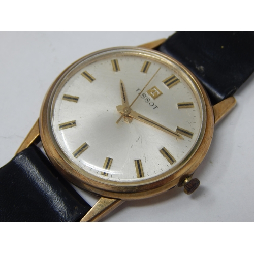 50 - Gent's 9ct Gold Tissot wristwatch with a leather strap