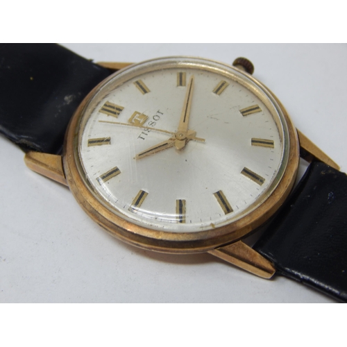 50 - Gent's 9ct Gold Tissot wristwatch with a leather strap