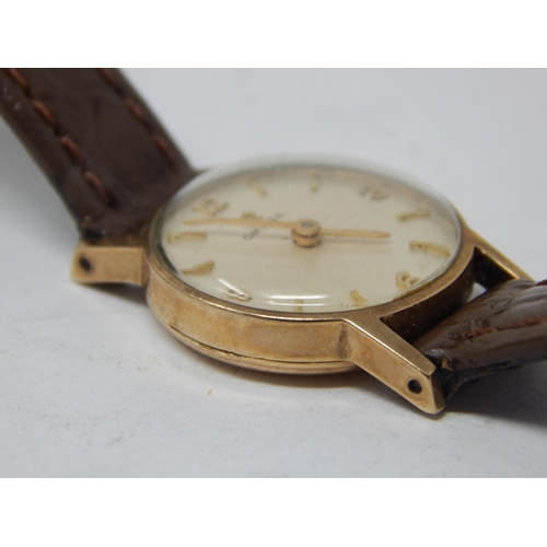 51 - Ladies 9ct Gold Omega wristwatch on leather strap