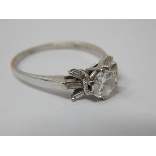 104 - Art Deco 18ct White Gold Ring Set with a Central Diamond Estimated @ 0.75cts Flanked with 6 Baguette... 