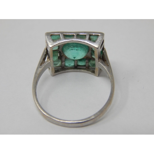 105 - Art Deco Platinum Ring Set with a Central Emerald Estimated @ 1.4cts within a border of 12 Emeralds ... 