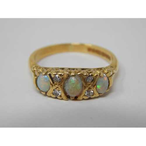 106 - 18ct Yellow Gold Ring Set with 3 Opals & 4 Diamonds: Ring Size L: Gross weight 4.3g