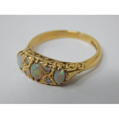 106 - 18ct Yellow Gold Ring Set with 3 Opals & 4 Diamonds: Ring Size L: Gross weight 4.3g