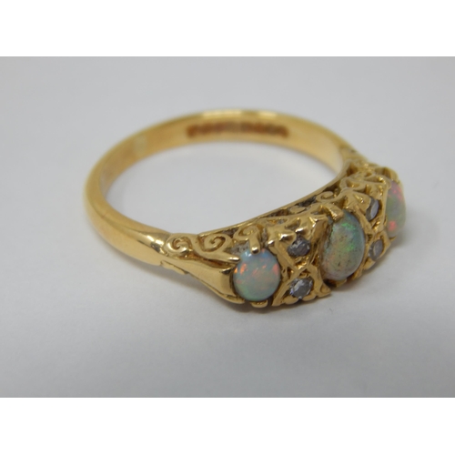 106 - 18ct Yellow Gold Ring Set with 3 Opals & 4 Diamonds: Ring Size L: Gross weight 4.3g