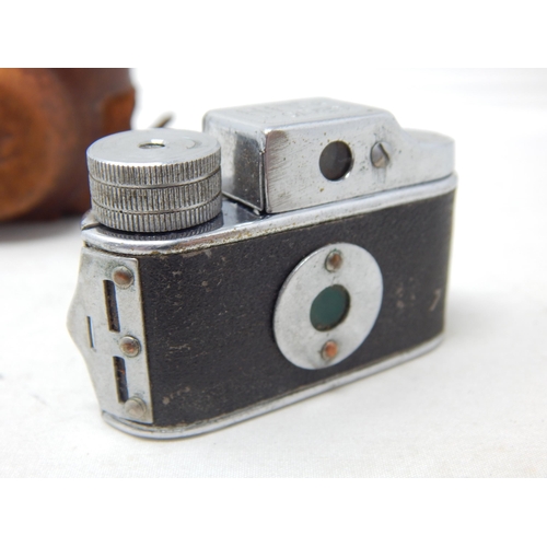 279 - A Miniature Spy Camera by HIT in Leather Case