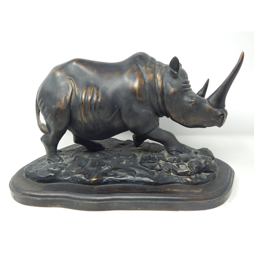 403 - Large Sculpture of a Rhinoceros on stand: Measuring 36cm wide